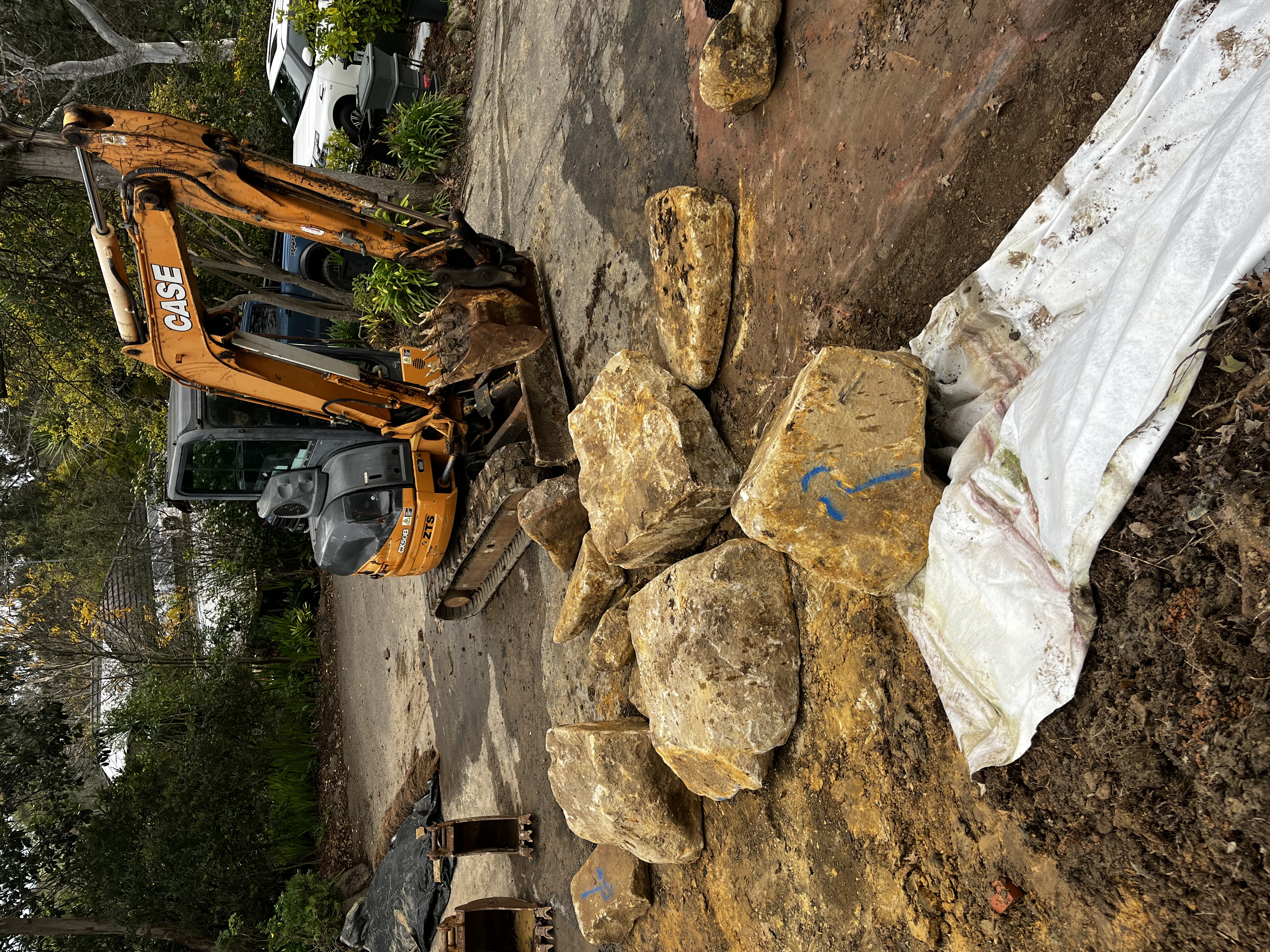 Excavated site with clean batters and a set out string line