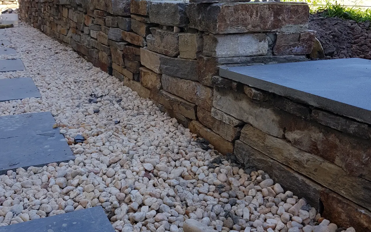 Finished exposed aggregate driveway at a completed home