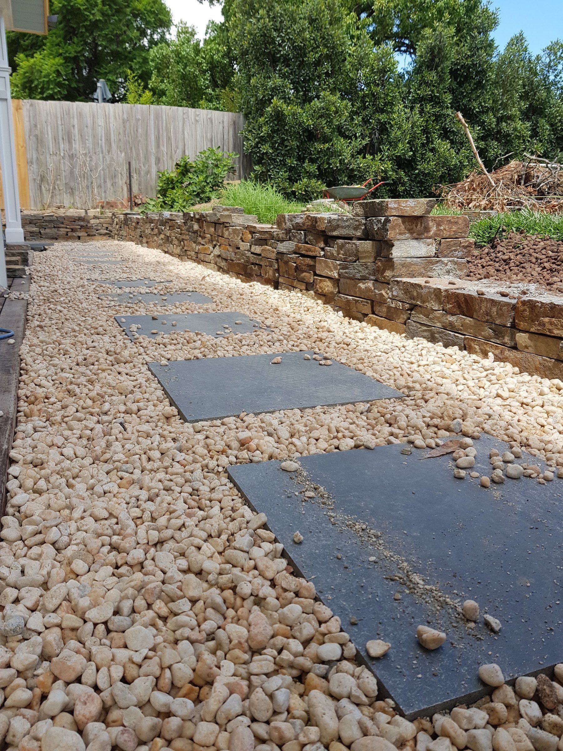 Pebble path, bluestone steppers and rock wall