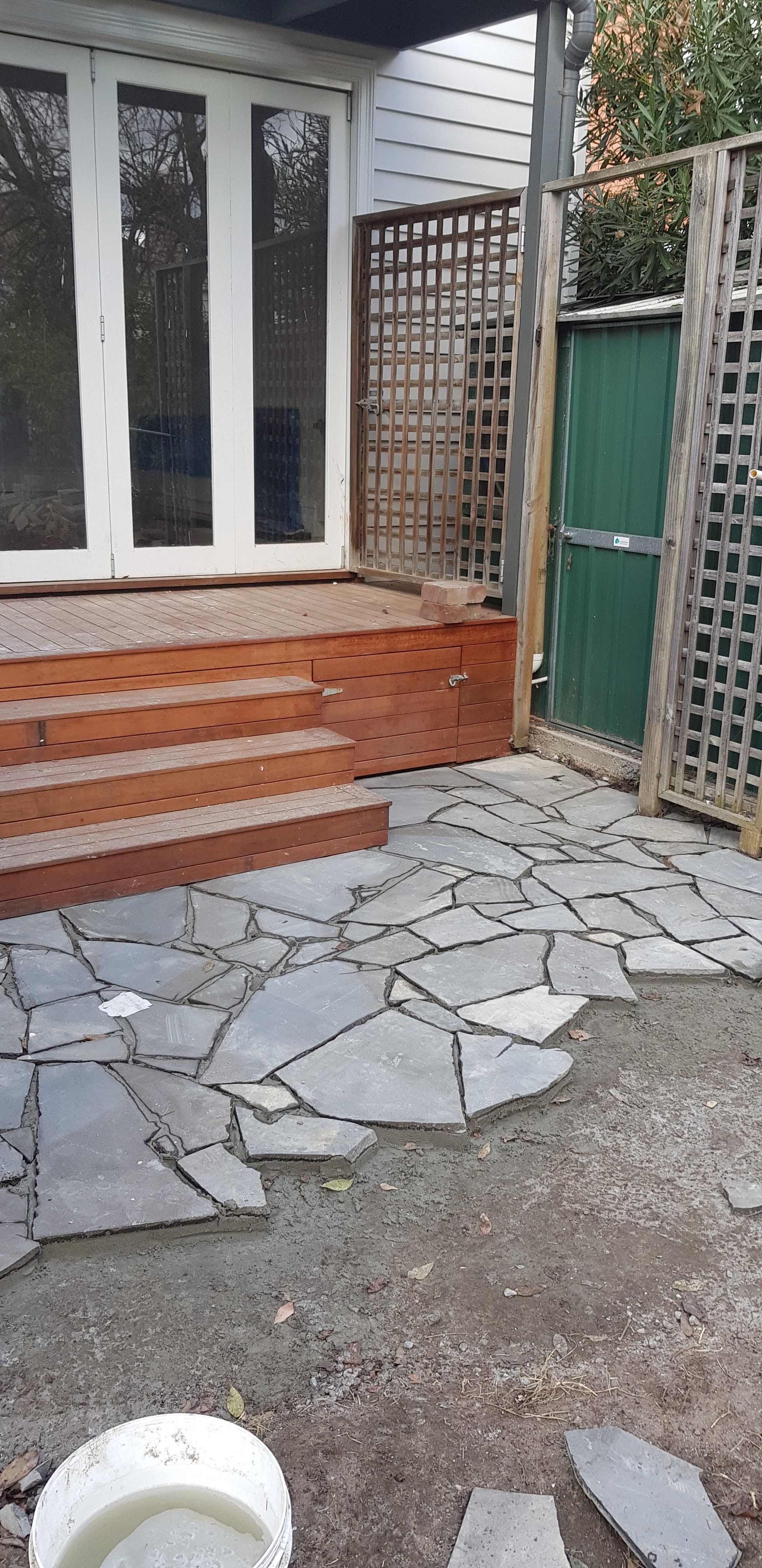 Crazy pave going in beside the deck
