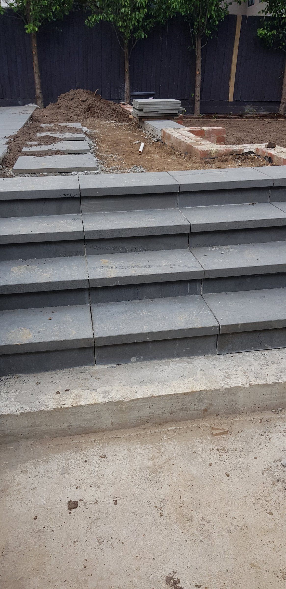 Paver steps and a concrete landing